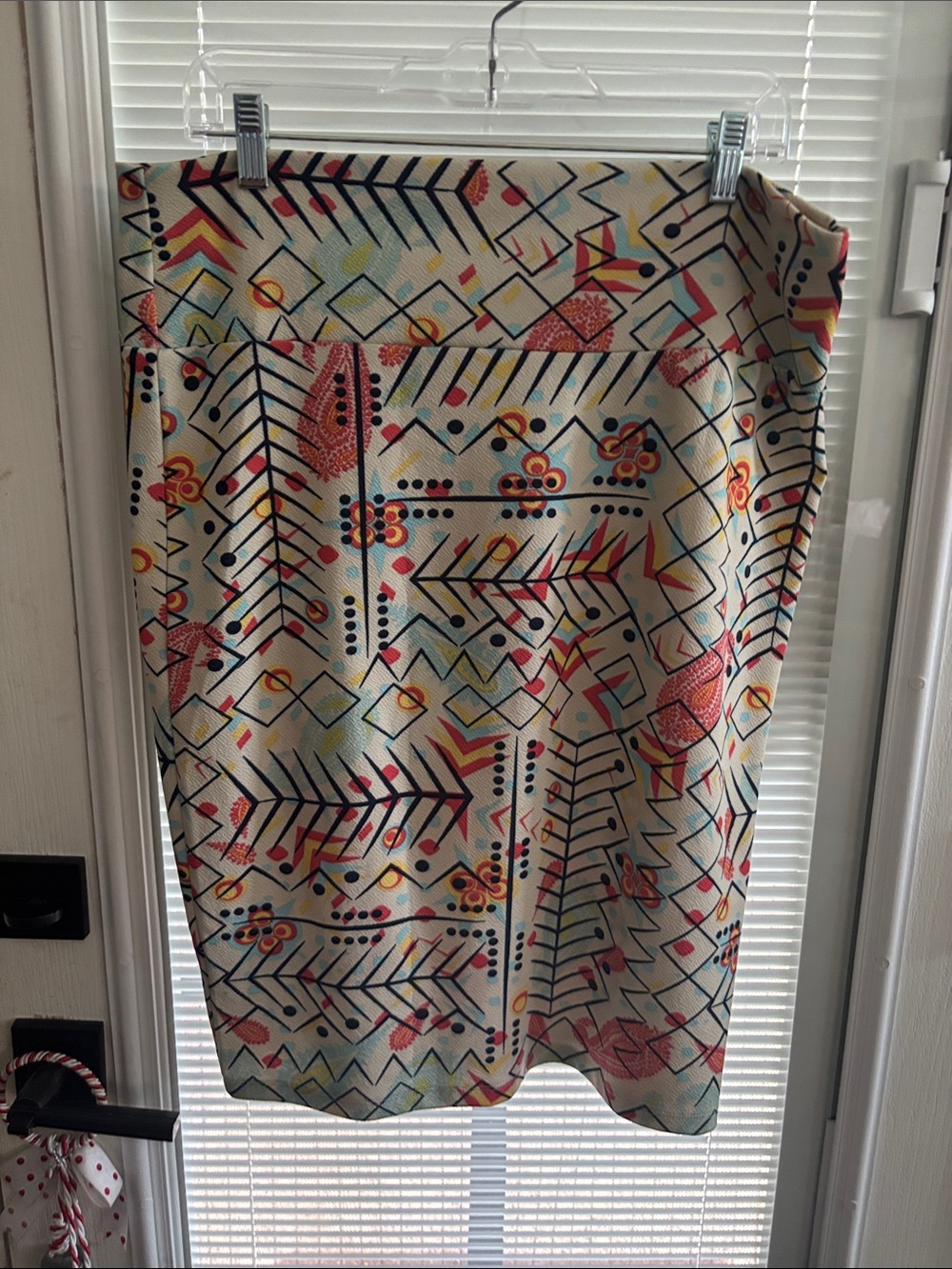LuLaRoe Cream Pencil Skirt with Red, Yellow & Blue Geometric Motif